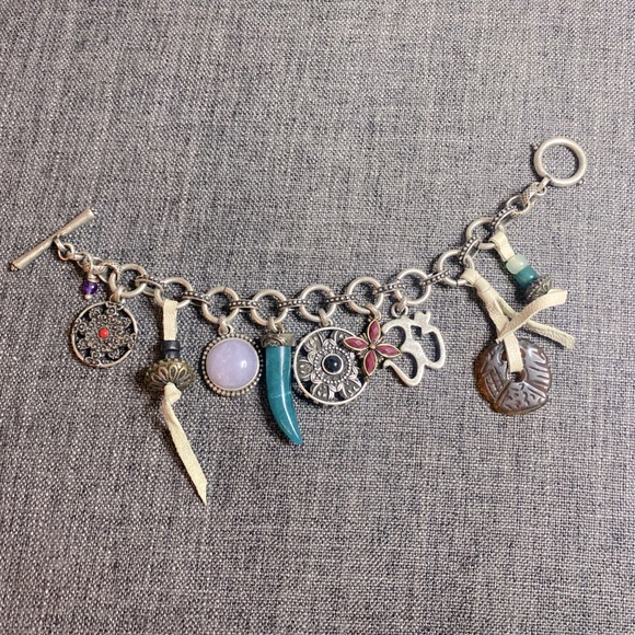 Lucky Brand Jewelry - Lucky Brand silver toned toggle bracelet with 9 charms.